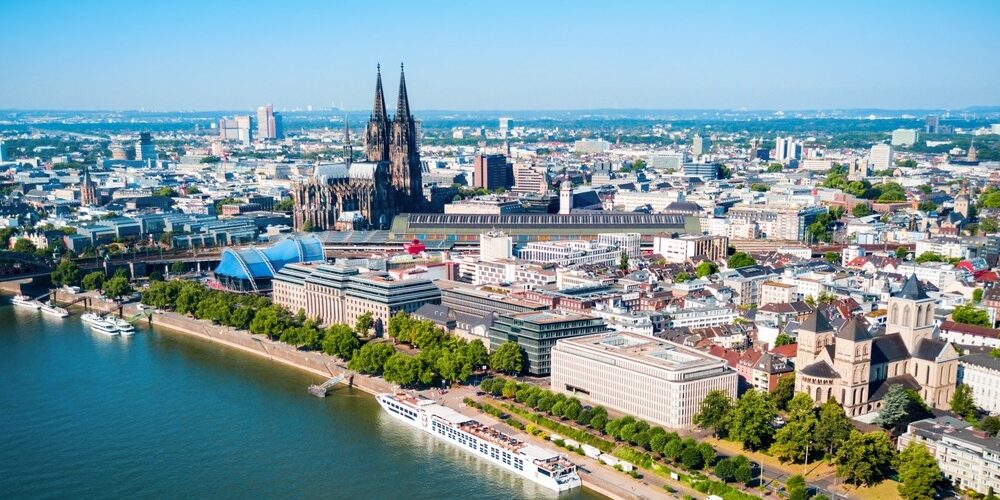 Cologne,Cathedral,And,Hohenzollern,Bridge,Through,Rhine,River,Aerial,Panoramic Cologne Germany