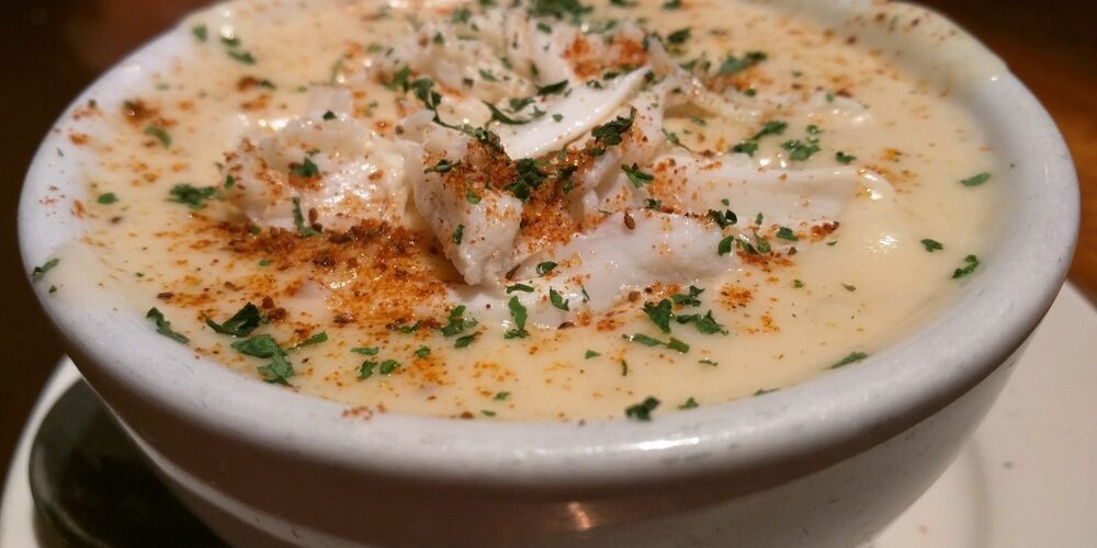 Bowl of She Crab Soup with crab meat garnish
